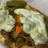 Cheezy Beef Sandwich · Homemade Italian beef on fresh French bread topped with mozzarella cheese and toasted.