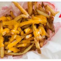 Cheese Fries · Our famous fresh cut fried topped with melted cheddar cheese.