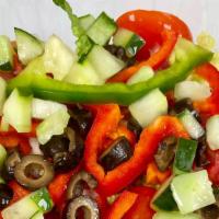 Garden Salad · Romaine lettuce, tomatoes, onions, black olives, cucumbers and mixed peppers.