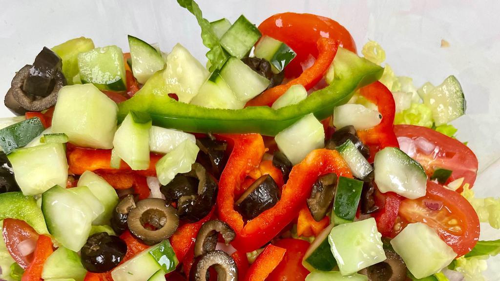 Garden Salad · Romaine lettuce, tomatoes, onions, black olives, cucumbers and mixed peppers.