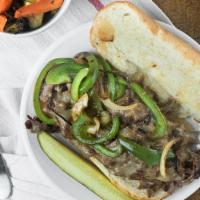 Philly Cheese Steak · Tender thin slices of steak smothered with provolone cheese, green peppers & grilled onions ...