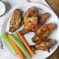 Wings · Grilled or fried. Served with celery, house-made bleu cheese or ranch dressing.