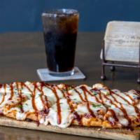 Bbq Chicken Flatbread · Shredded mozzarella over a layer of bacon onion jam & topped with chopped cilantro, red onio...