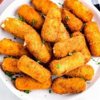 Fried Mozzarella Sticks · Six mozzarella sticks with marinara sauce.