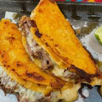 Taco De Birria · Beef birria meat taco topped with onions & cilantro