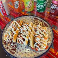 Hotdogs A La Mexicana (3) · Mexican style hotdogs

3 hotdogs with bacon wrapped around the wiener. Mayo spread bun and t...