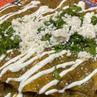 Enchiladas Verdes (4) · 4 green enchiladas filled with shredded chicken. Topped with sour cream, cilantro, diced oni...