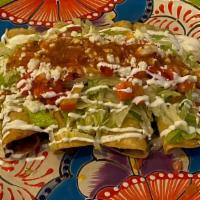 Flautas Mexicanas · 4 Flautas filled with your choice of shredded chicken or pork. Topped with lettuce, tomatoes...