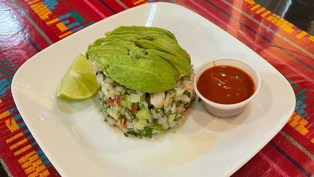 Ceviche · Diced shrimp mixed in with diced onions, tomatoes, cilantro & cucumber. Cooked in lime juice. Served with avocado slices.