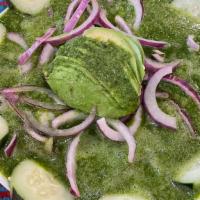 Aguachiles · Raw shrimp cooked with lime juice & a spicy green salsa. Topped with sliced red onions, avoc...