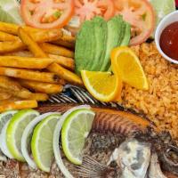 Mojarra Frita · Whole Tilapia Fish, fried,  served regular, with garlic butter or Ala Diabla (Hot) with a si...