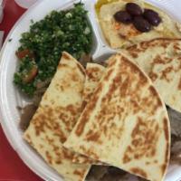 Gyros Platter · Rice, Gyros meat, greek salad (tabouli), hummus, tzatziki sauce, and pita bread.