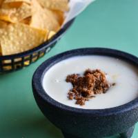 Chorizo Queso + Chips · Spicy Spanish Sausage.