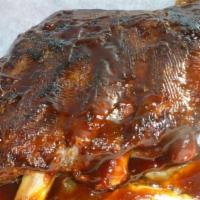 Slab Ribs · St. Louis Style BBQ Ribs, A Louie favorite! Meaty ribs basted with tangy barbecue sauce serv...