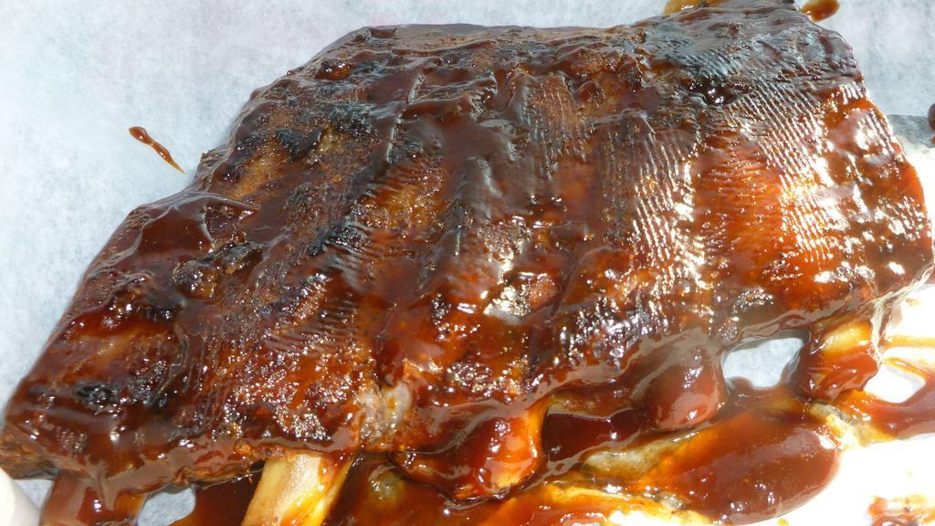 Slab Ribs · St. Louis Style BBQ Ribs, A Louie favorite! Meaty ribs basted with tangy barbecue sauce served with your choice of 2 sides.