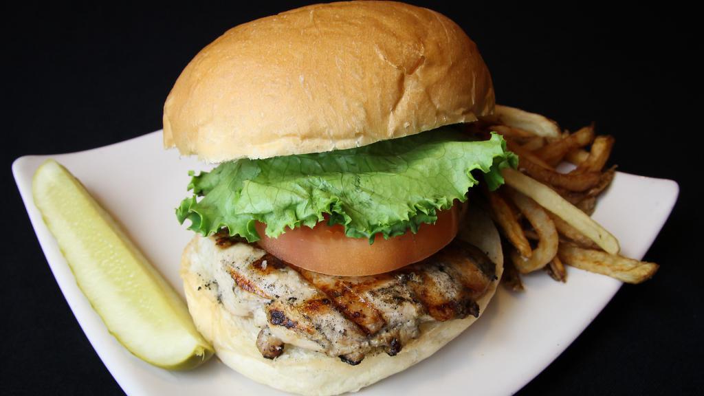 Grilled Chicken · Marinated grilled chicken breast with choice of provolone, swiss or pepper jack cheese. Served on a kaiser bun. served with shredded iceberg lettuce, tomato, house kettle chips, and a pickle spear.