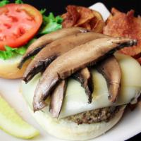 Brown Bomber Portobello · Half pound patty with sliced portobello mushrooms and swiss cheese. Served with shredded ice...