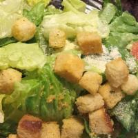 Caesar Salad · Iceberg and romaine lettuce, bacon, croutons, parmesan cheese and tomatoes.