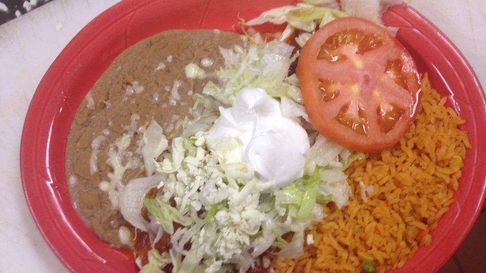 Burrito La Cascada · A flour tortilla stuffed with your choice of seasoned ground beef or shredded chicken. Topped with burrito sauce, lettuce, sour cream, tomatoes and cheese and served with rice and beans.