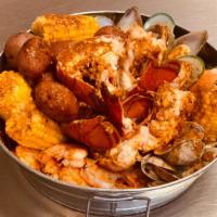 New England · 4 Pcs  lobster Tail, 1LB of shrimp, 1LB of clams, 1LB mussels, four pieces of corn, four pie...