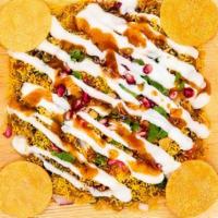 Papdi Chat · Yummy street snack assorted with crunchy base of poori which is topped with lip-smacking chu...