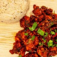 Chicken Majestic · Spiced, battered & fried white meat sauteed w/ red chillies, assorted spices & cilantro.