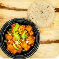 Paneer Manchurian · Spiced & battered cheese pieces cooked w/ authentic manchurian sauce, topped w/ shreds of gi...
