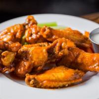 Smallbar Wings · Eight large wings, fried and tossed in choice of buffalo, BBQ, honey mustard, or Thai chili ...