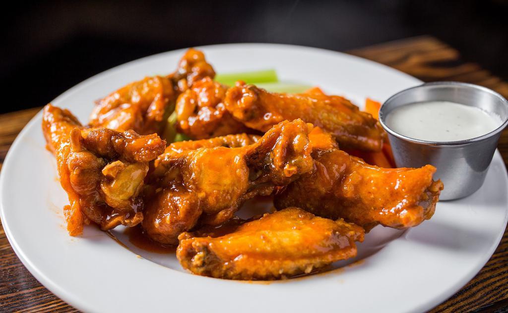 Smallbar Wings · Eight large wings, fried and tossed in choice of buffalo, BBQ, honey mustard, or Thai chili sauce. Served with carrot, celery sticks and choice of bleu cheese or ranch.
