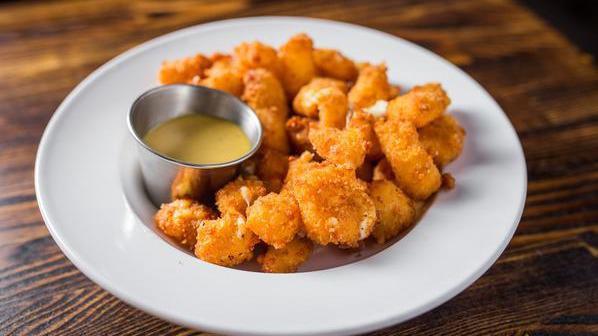 Fried Cheese Curds · Beer-battered cheddar cheese curds from ellsworth dairy. Served with honey mustard.