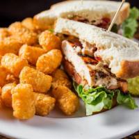 Smallbar Chicken · House favorite combines seasoned grilled chicken, bacon, lettuce, tomato, and remoulade on s...