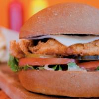 Chicken Deluxe Sandwich · Crispy, golden chicken hand-breaded, topped with fresh lettuce, juicy tomatoes, crunchy pick...