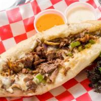 Philly Steak & Cheese · Rib-eye beef, green bell pepper, onions, mozzarella and swiss cheese atop a lightly toasted ...