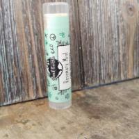 Good Earth Lip Butter Rosemary Mint · 0.15 oz tube of handcrafted lip butter.