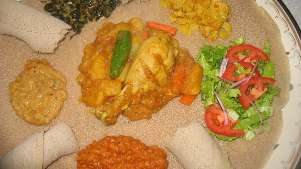 Traditional Doro Wot (Mild) · One tender chicken leg marinated in lemon juice cooked with homemade mild sauce and served Ethiopian style with a hard-boiled egg.