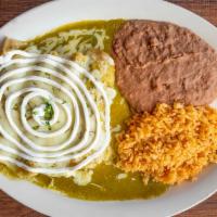 Enchiladas Zuizas · Four enchiladas with corn tortilla with chicken of green or red salsa served with
rice and r...