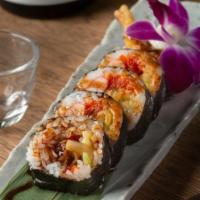 Spider Roll · Soft shell crab, cucumber, avocado, crab stick, masago, and lettuce with eel sauce.