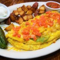 Chicken Fajita Omelette · Grilled chicken, bell peppers, onions, tomatoes, and shredded cheese. Served with a jalapeño...