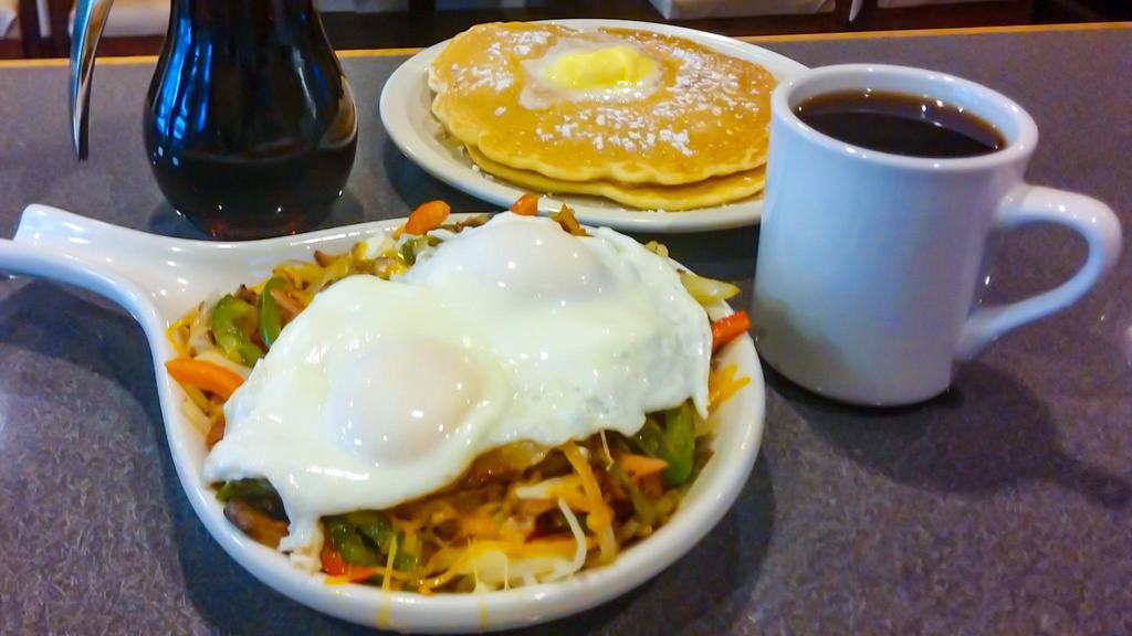 500'S Skillet · Canadian bacon, ham, gyro meat, sausage, bacon, chorizo, bell peppers, onions, mushrooms, and tomatoes with hash browns and topped with shredded cheese and two eggs any style.