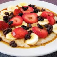 Fruity Oatmeal · Topped with Strawberries, Bananas, Raisins and Brown Sugar.