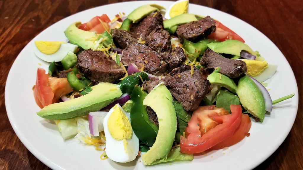Avocado Steak Salad · Mixed lettuce, prime rib steak, red onions, tomatoes, green peppers, bacon, hard-boiled egg, shredded cheese and our fresh avocado slices. Served with your choice of dressing.