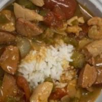 Gumbo · Savory Gumbo  made with Cajun Sausage, Shrimp, and Chicken. Only served with rice and cornbr...