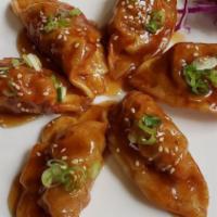 Sweet & Spicy Dumpling · 6 pieces. Deep-fried dumpling tossed in sweet and spicy sauce.