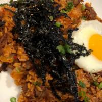 Kimchi Beef Fried Rice / 김치볶음밥 · Stir-fried white rice with kimchi, onions, marinated chopped beef bulgogi. With egg for an a...
