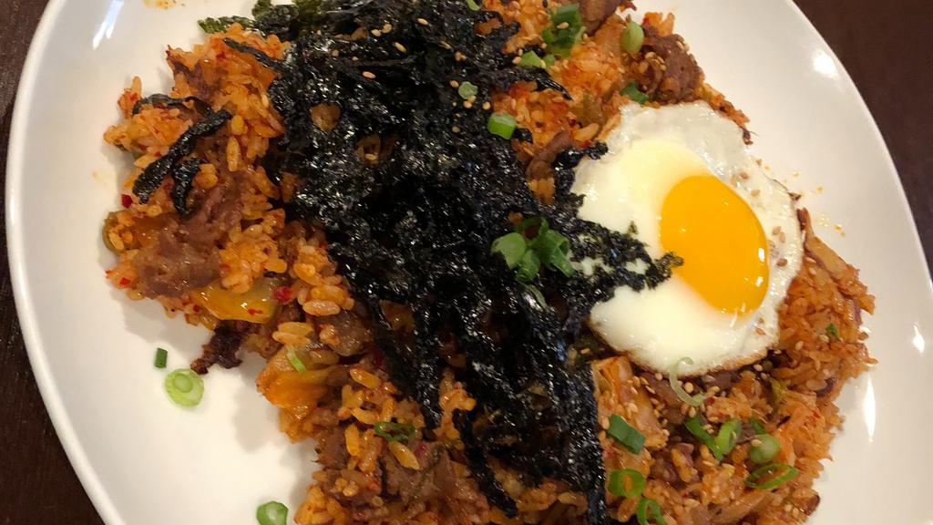 Kimchi Beef Fried Rice / 김치볶음밥 · Stir-fried white rice with kimchi, onions, marinated chopped beef bulgogi. With egg for an additional charge.
