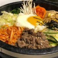 Bibimbap / 비빔밥 · Rice topped with vegetable medley with your choice of beef or tofu.