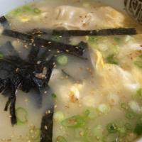Duk Mandu Soup · Thin sliced rice cake with dumplings (pork or vege) in mild chicken broth soup with egg, ses...