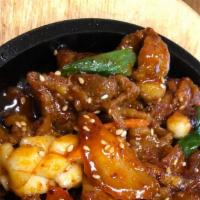 Spicy Squid Pork Belly / 오삼불고기 · Squid and pork bellies stir-fried with assorted vegetables in sweet & spicy sauce.