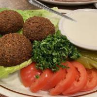 Falafel Plate · Gluten-free, vegetarian. All veggie patties served with lettuce, tomatoes, pickles and tahin...