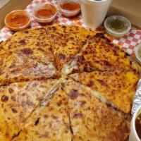 Pizzadilla · Comes with onions & cilantro inside pizza.
Comes with a side of limes, cucumbers, red & gree...